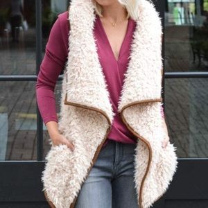 Fuzzy faux lamb fur with leather trim vest